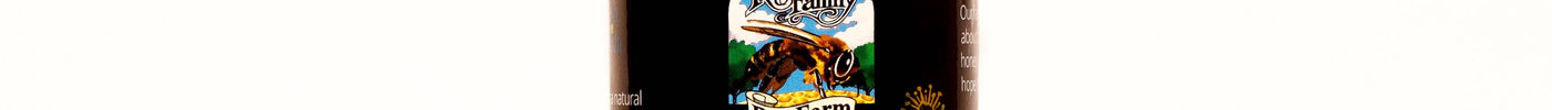 Glass tower jar of Raw Tupelo Honey from Register Family Farm