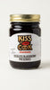 Jar of Kiss the Cook Seedless Blackberry Preserves on a white background