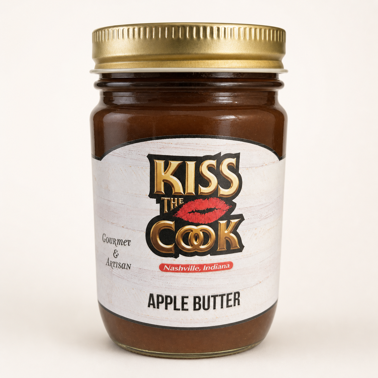 Jar of Kiss the Cook Apple Butter on a white background