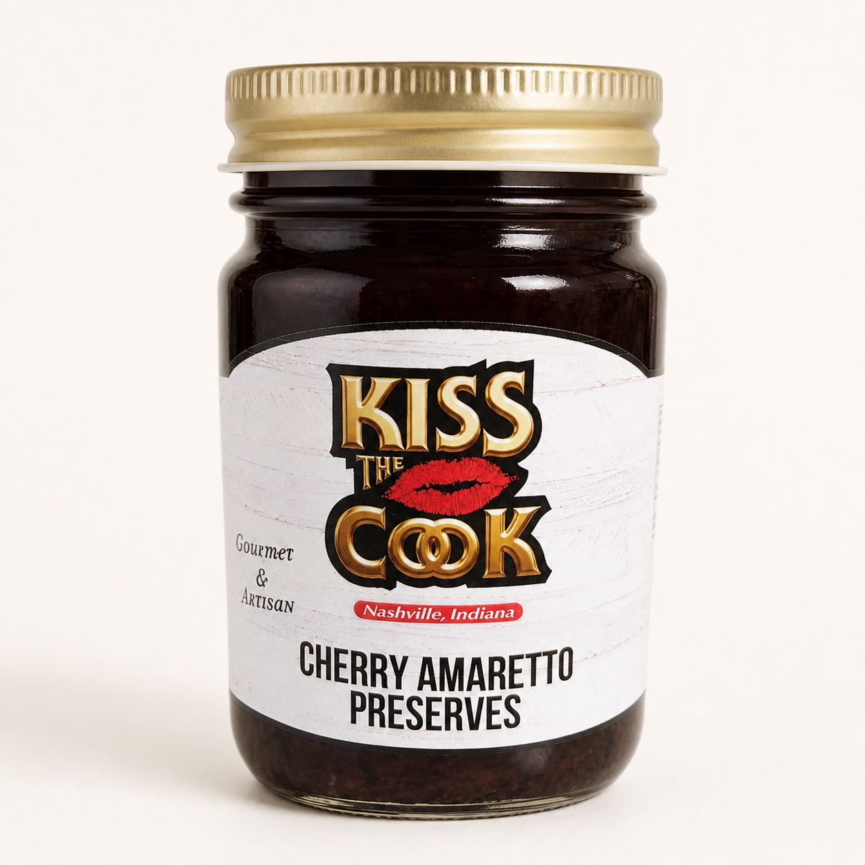 Jar of Kiss the Cook Cherry Amaretto Preserves on a white background