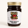 Jar of Kiss the Cook Cherry Amaretto Preserves on a white background